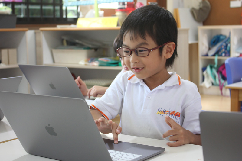 Students exploring digital tools during technology-integrated lesson