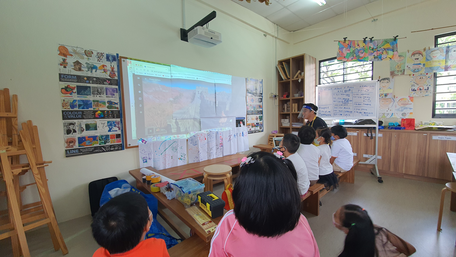 Students building and exploring in ArKIDtects in Wonderland exhibition